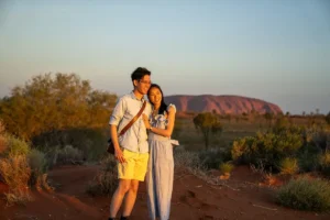 Couple (man and woman) embracing at Uluru